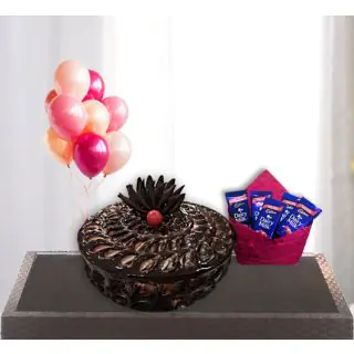  chocolate fudge cake with pack of 5 dairy milk chocolates with bunch of 5 blown balloons 