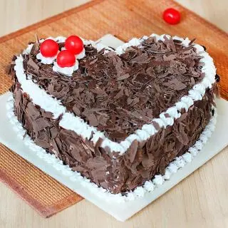  heart shape black forest heart shape cool cake with chocolate flakes topping  
