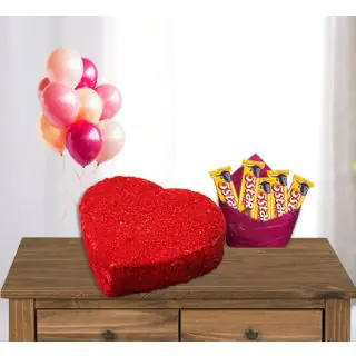  heart shape red velvet cake with bunch of 5 blown balloons with pack of Five 5 star  chocolates 