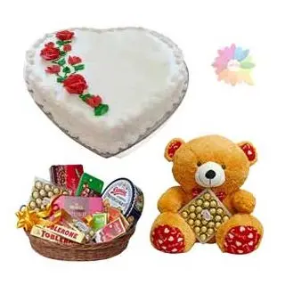 heart shape vanilla cake with assorted chocolate hamper of premium chocolates with 3 feet height teddy bear carrying 24 pcs rocher ferrero chocolates 