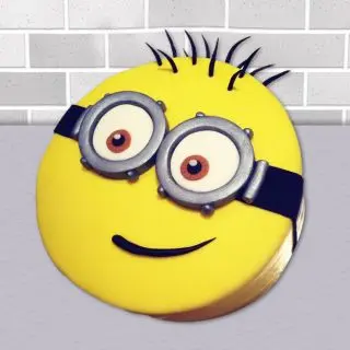  Minion shape cake in white forest flavour 