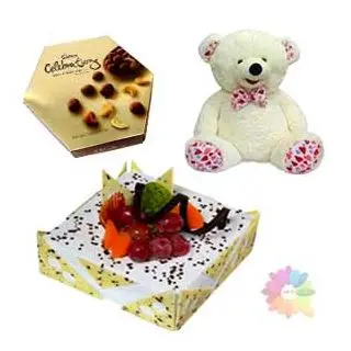 Pineapple cake with exotic fruits topping with celebration box of rich chocolates with 1 feet height teddybear 