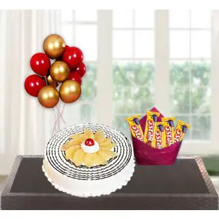  pineapple cool cake with bunch of 5 blown balloons with set of five 5 star chocolates 