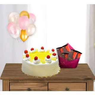 pineapple premium quality cake with pack of 5 bournville chocolates with 5 blown balloons 