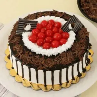 premium quality black forest cakes cool  with cherry topping 