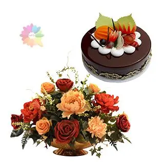 Beautiful basket arrangement of mix colour roses with 1 pound chocolate mix fruit cake