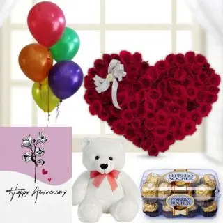 Heart shape arrangement of 100 red roses, 1 feet height teddybear , 16 pcs rocher ferrero chocolates, anniversary Greeting card with 5 blown balloons  