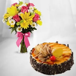 20 Mix flowers arranged in glass vase with half kg irish coffee cake 