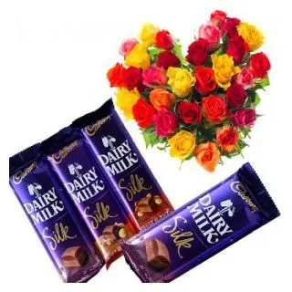 Beautiful heart shape arrangement of 20 mix roses with 4 dairy milk silk cadburies
