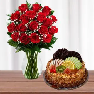 20 red roses in glass vase with half kg butterscotch fruit cake 