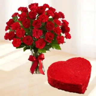 20 red roses with red carnations in glass vase with half kg heart shape red velvet cake 