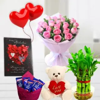 Bunch of 15 pink roses, 6 inch height teddybear, pack of 5 Kitkat chocolates, 2 layer Lucky bamboo plant, 5 blown balloons with greeting card