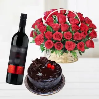 Beautiful basket arrangement of 50 red roses with double chocolate cake with bottle of red wine