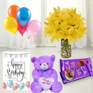 8 Yellow lilies in glass vase,  1 feet height teddybear, set of 2 dairy milk silk, birthday Greeting card with 5 blown balloons 