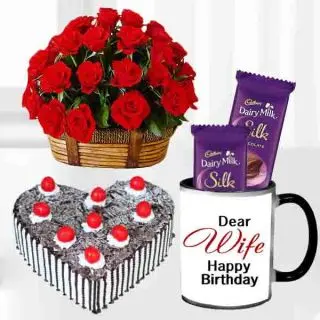 Basket arrangement of 15 red roses, 1 kg heart shape black forest cake, 2 dairy milk silk in photo mug 