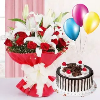 Basket arrangement of red roses and white lilies with chocolate truffle cake with 3 blown balloons