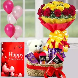 Bunch of 15 red and yellow roses,  6 inch teddybear sitting in chocolate basket with 4 silk , 2 fabelle chocolates, Greeting card with 5 mix blown balloons 