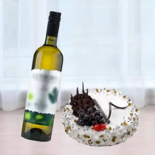 Rum n raisin cake  with bottle of white wine