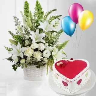 Arrangement of exotic white flowers with heart shape strawberry vanilla cake with 3 blown balloons
