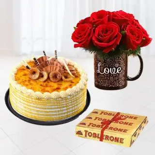 10 red roses arranged in photo mug , half kg honey cake, set of 3 toblerone chocolates 