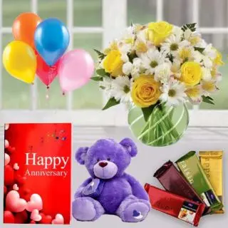 Vase arrangement of 15 roses and daisies, 6 inch teddybear , set of 4 temptations chocolates, anniversary greeting card with 5 blown balloons 
