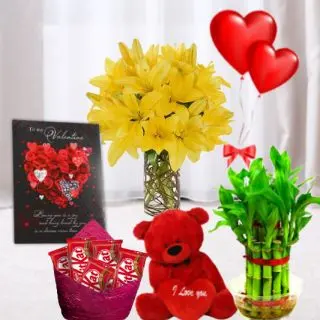 10 yellow lilies arranged in Glass Vase, pack of 5 fivestar, 6 inch  height teddybear, 2 layer Lucky bamboo plant, 5 blown balloons with greeting card 