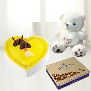  heart shape pineapple cake with  2 feet height teddy bear with box of celebration rich chocolates 