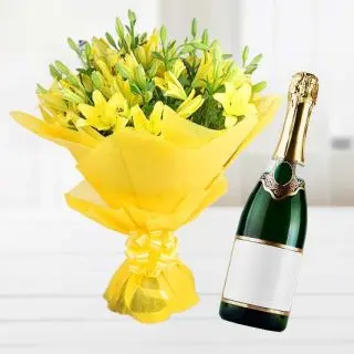 Bunch of 10 yellow asiatic lilies with bottle of champegne