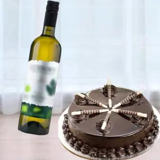 choco stick cake with bottle of white wine 