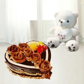  chcolate heart shape cake with exotic fruits topping with 3 deet height teddybear