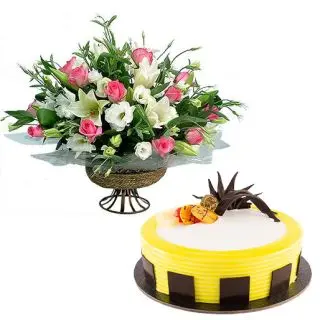 Basket arrangement of white lilies&pink roses with 1 kg pineapple fresh cream cake