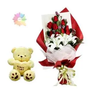 Bunch of exotic white lilies with red roses along with 1 feet height teddy bear