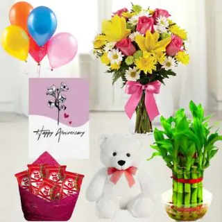 vase arrangement of 20 mix exotic flowers , pack of 5 kitkat chocolates, 6 inch height teddybear, 2 layer Lucky bamboo plant ,5 blown balloons with anniversary greeting card
