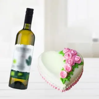 heart shape vanilla cake with bottle of white wine 