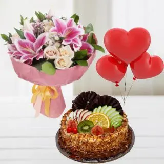 Beautiful Bunch of mix flowers including roses, lilies , carnations with mix fruit fresh cream cake with 3 heart shape balloons