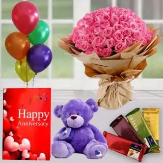 50 red roses bunch ,  6 inch teddybear , set of 4 temptations chocolates, anniversary greeting card with 5 blown balloons 