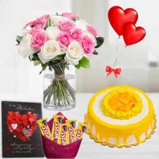 Beautiful pink and white roses vase arrangement half kg mango fresh cream cake, pack of Five 5star chocolates ,2 heart shape balloons ,with greeting card 
