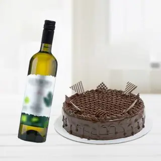 chocolate truffle cake with bottle of white  wine 