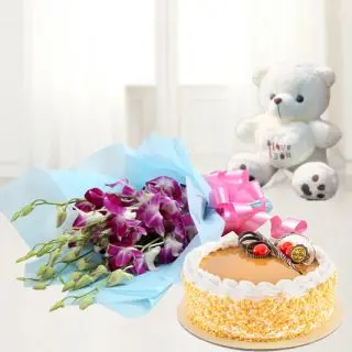 Bunch of orchids with fresh cream 1 kg butterscotch cake with a cute 6 inch teddy bear