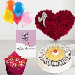 50 red roses heart shape arrangement, pineapple premium quality cake, pack of 5 Kitkat chocolates, anniversary greeting card, with 5 blown balloons
