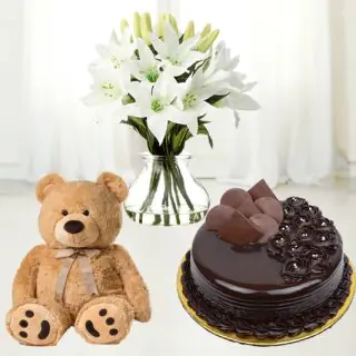 10 white lilies in glass vase with chocolate fudge cake with 6 inch teddybear 