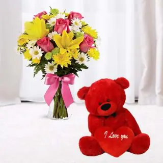 Vase arrangement of 15 mix exotic flowers with cute 6 inch teddy bear 