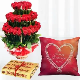 100 red roses designer arrangement , photo cushion with set f 3 toblerone chocolates 