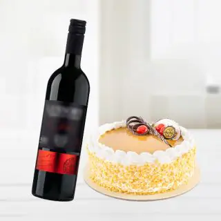 butterscotch cake with bottle of red wine