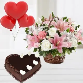 Exotic Basket arrangement of lilies&roses arrangement with chocolate truffle heart shape cake with 3 heart shape balloons