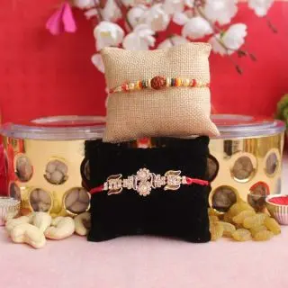 2 fancy rakhi with  box of 300 grams cashew raisins 