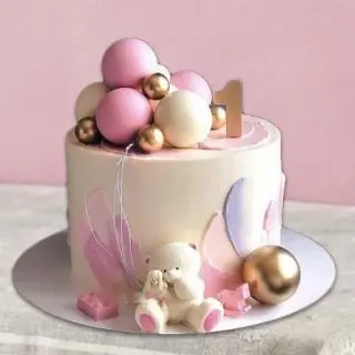 designer cake for 1st birthday with balloons and rabbit theme 