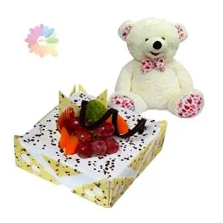 2 kg pineapple fresh cream cake with exotic fruits topping  with 2 feet height white colour teddy bear