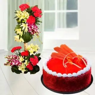2 storey Exclusive arrangement of lilies, roses, orchids, carnations in 2.5 feet height with red velvet cool cake 