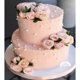 2 tier peach cake with floral theme in butterscotch flavour in 2 kg 